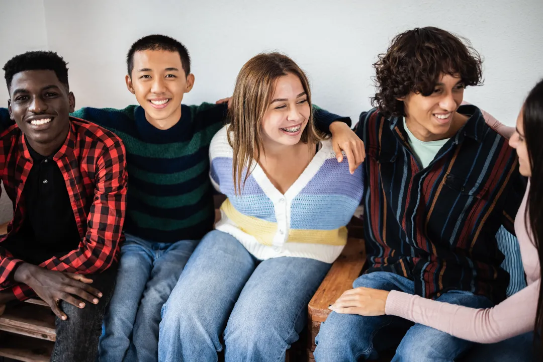 Happy young people on a sofa